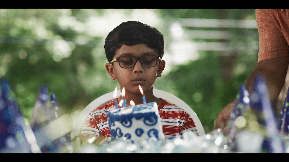 child disappointed by half of birthday cake