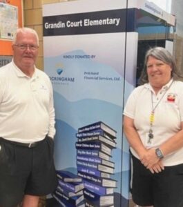 Book vending machine at Grandin Court Elementary with Ron and Terri Pritchard